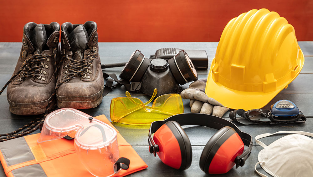 work boots, helmet, ear and eye protective gear